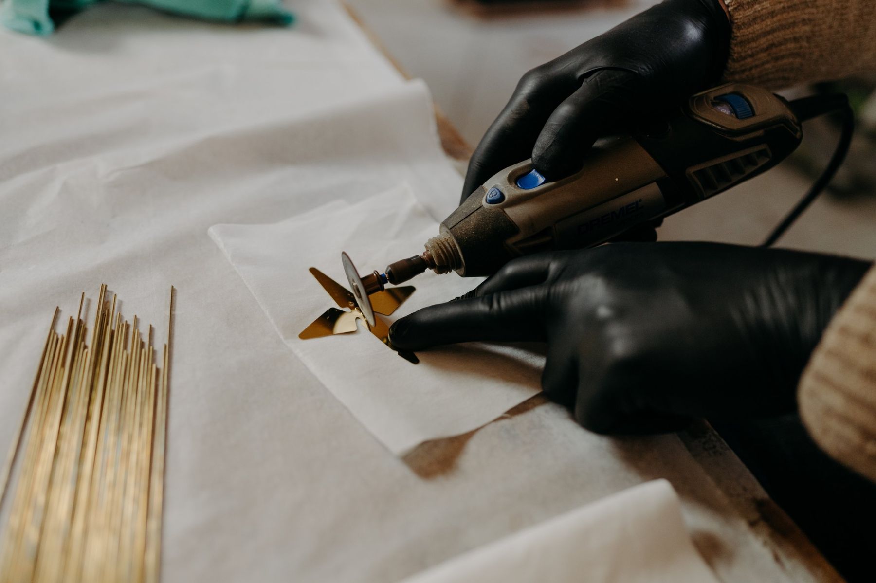 Deburring a brass crane with a rotary tool.