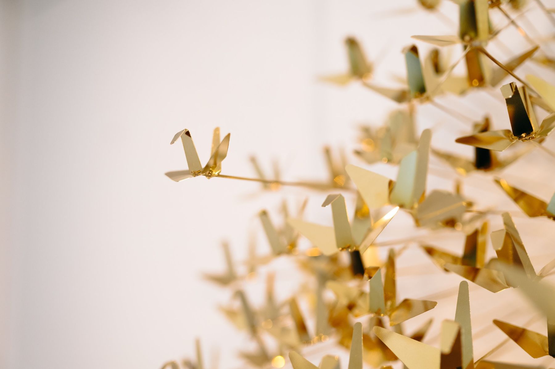 Close-up of polished brass cranes.